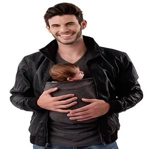 Detail view of a man wearing a functional kangaroo pouch T-shirt carrying a small infant.