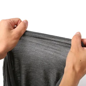 Close-up detail showing the high elasticity and breathable texture of the grey fabric.