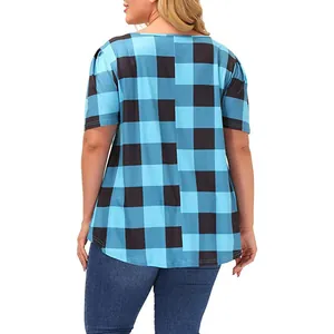 Back view of a plus-size women's loose blue and black buffalo plaid short-sleeve top