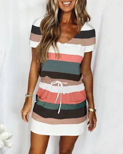 Close-up detail of women's short sleeve striped dress with drawstring waist and pockets.