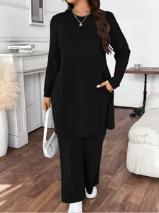 Elegant black two-piece lounge set for women featuring long sleeve tunic and trousers