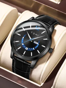 Close-up of TOMI fashion watch featuring black leather strap and moon phase dial