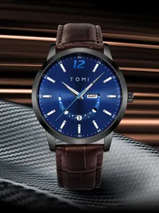 TOMI fashion round watch featuring a deep blue dial and brown leather strap details