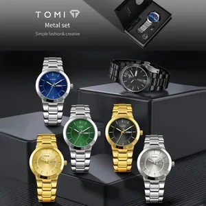 Professional studio shot of TOMI men's metal watch set with luxury gift box packaging