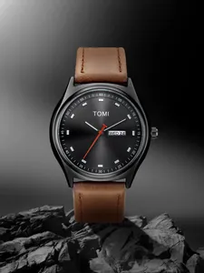Close-up of TOMI minimalist watch with day-date window and brown leather strap