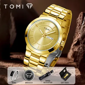 Luxury gold men's watch gift set including ring, brooch, and adjuster in box.