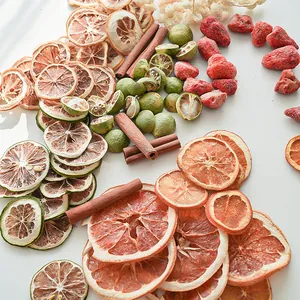 Natural dried fruit slices and cinnamon sticks for DIY handmade aromatherapy specimens.