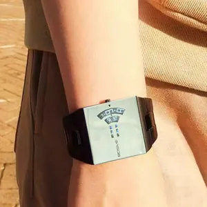 Close-up of trendy square men's quartz watch with black steel strap on wrist
