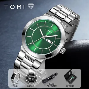Elegant men's silver wristwatch gift set with sunburst green dial, ring, and brooch