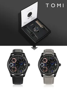 Dettaglio del set regalo orologio al quarzo TOMI da uomo con cinturini in pelle nera e grigia
