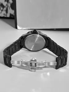 Detailed back view of TOMI men's business watch with black stainless steel band.