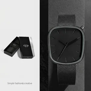 Montre à quartz minimaliste noire en forme de galet avec bracelet en maille et boîte