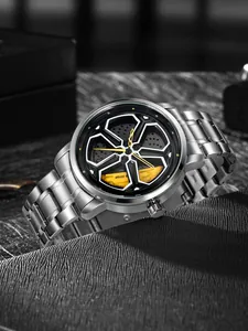 Detail view of men's quartz watch featuring a rotating car wheel rim design dial.