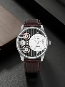 Vista dettagliata dell'orologio al quarzo da uomo TOMI con quadrante e cinturino marrone.