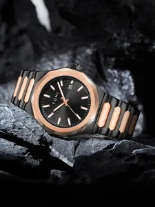 Close-up view of a TOMI minimalist men's business watch with a sleek black steel strap