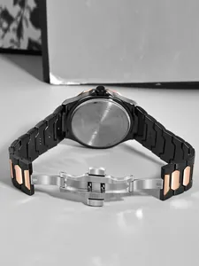 Detailed view of TOMI men business watch with black and rose gold steel band