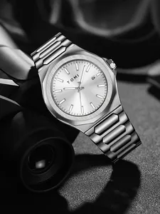 Close-up of TOMI silver stainless steel business watch with octagonal bezel