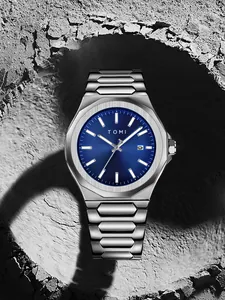 Close-up of TOMI men's business watch featuring blue sunburst dial and silver steel band.