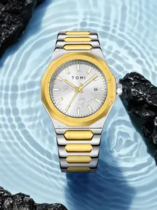 Close-up of a TOMI business men's watch featuring a two-tone steel strap on water
