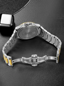 Detail view of two-tone stainless steel watch band and secure butterfly buckle.