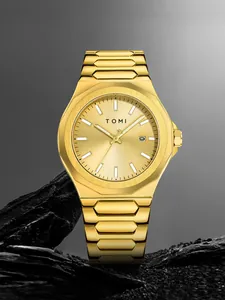 Professional detailed shot of TOMI minimalist gold steel band watch for business men.