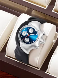 Close-up of asymmetrical Y2K wristwatch with blue dial and black rubber strap