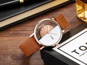 Detail of unisex quartz watch with skeleton design and brown leather strap