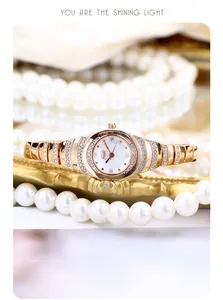 Close-up of GEDI women's rose gold bracelet watch with crystal-set bezel and white dial