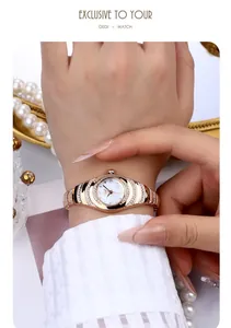 Close-up of GEDI women's rose gold quartz bracelet watch with rhinestones on wrist