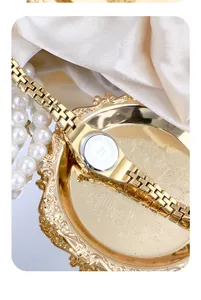 Macro detail of GEDI women's gold vintage bracelet watch case back and strap