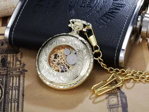 Close-up of a vintage golden mechanical skeleton pocket watch with intricate engravings