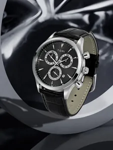 Macro detail of TOMI men's business chronograph quartz watch with black leather strap