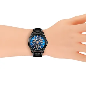 Gros plan montre automatique squelette T-WINNER pour homme avec cadran bleu.