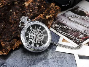 Detailed view of a vintage silver mechanical pocket watch with hollow Roman numerals
