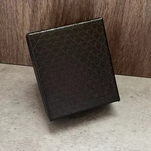 Close-up view of a black diamond-textured gift box designed for pocket watches
