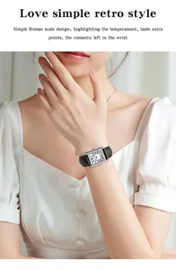 Detail of Sanda quartz watch with Roman numerals and black leather strap on wrist
