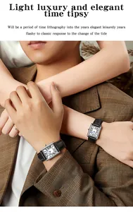 Detail of elegant couple watches with Roman numeral dials and leather straps