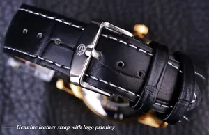 Close-up of black genuine leather watch strap with silver buckle and white stitching