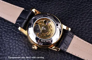 Detail shot of the transparent case back revealing the intricate gold automatic movement
