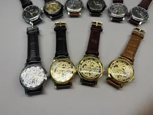 Close-up of T-Winner skeleton mechanical watches with leather straps and gear details