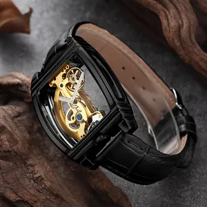 Montre automatique squelette élégante avec mouvement à pont doré et bracelet en cuir noir