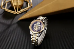 Detailed view of luxury silver and gold skeleton watch with mechanical gears