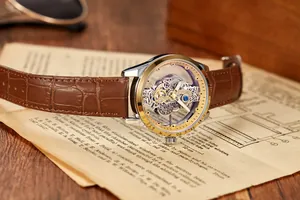 Detail of a men's luxury watch with a double-sided skeleton movement and brown leather strap.