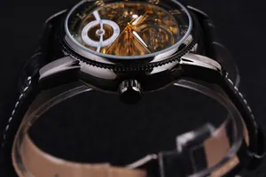 Macro view of skeleton mechanical watch dial with gold movement and black leather strap.