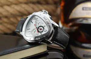 Close-up of a men's triangular automatic watch with white dial and black leather strap