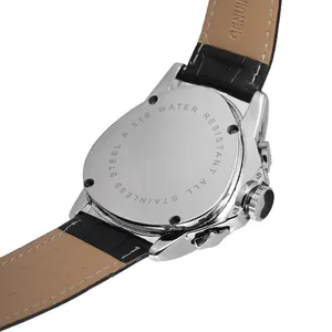 Detailed macro view of stainless steel triangular mechanical watch back and leather strap