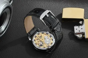 Detail view of the skeleton mechanical movement and black leather strap of the T-Winner watch.
