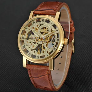 Close-up of T-Winner gold skeleton mechanical watch with brown leather strap