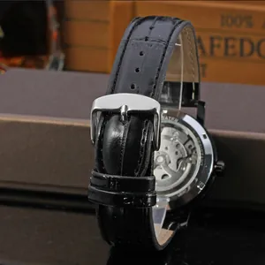 Close-up of T-Winner mechanical watch back showing movement and leather strap