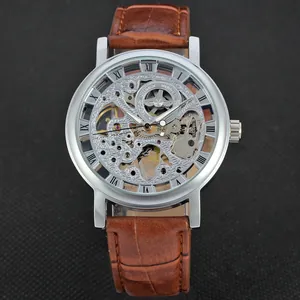 Detailed close-up of T-Winner skeleton mechanical watch with a brown leather strap